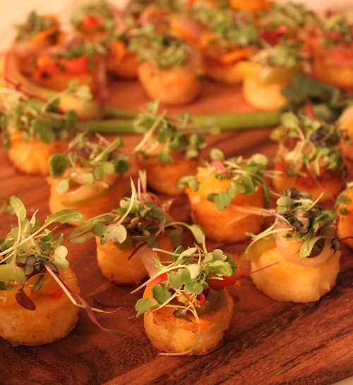 Sauteed Polenta Cakes with Mushroom Ragu and Microgreens