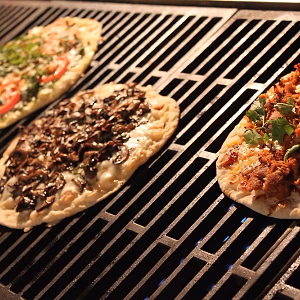 Pizzas Getting Crispy on the Grill