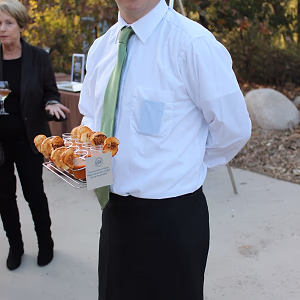 Server Tray Passing Mini Grilled Cheese Sandwiches with Soup Shots