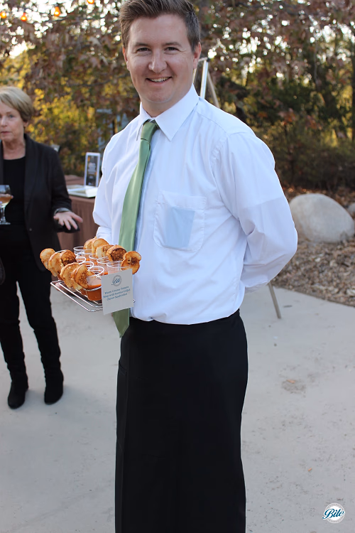 Server Tray Passing Mini Grilled Cheese Sandwiches with Soup Shots