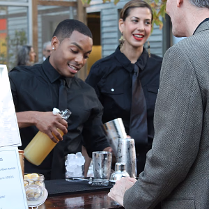 Bartender pouring cocktails