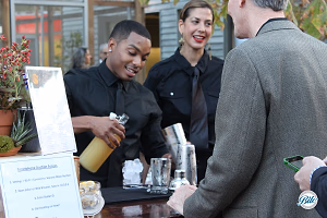 Bartender pouring cocktails