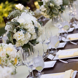 Gorgeous summery locally-sourced arrangements for a family-style reception dinner