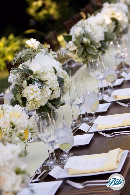 Gorgeous summery locally-sourced arrangements for a family-style reception dinner