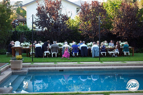 Intimate family-style wedding reception - One long table!