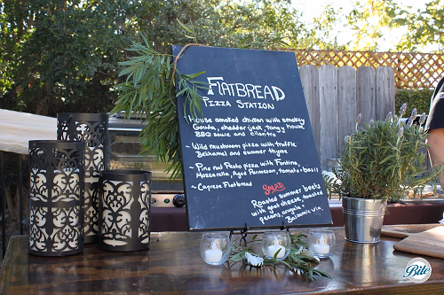 Hand-written chalkboard signage and fresh from the garden lavender and greenery