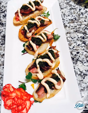 The guests were served yummy flank steak crostini bites
