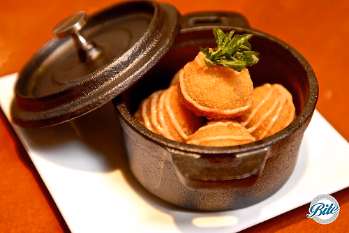 Croquettes displayed in cast iron serving pot