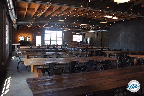 Main room set with wood tables @ Smoky Hollow Studios
