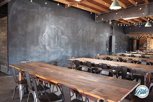 Rustic wood tables and large creative wallspace @ Smoky Hollow Studios