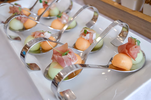 Melon and Prosciutto on Silver Spoons