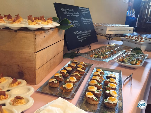 Brunch on display w/ eggs and bacon, mini breakfast basket,melon and mozzarella spoons, and mini french toast 