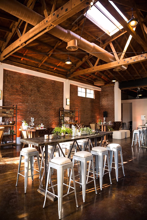 At the P - Interior View w/ Brick Wall and Tables