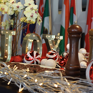 Closeup of Joy and Ornaments on Holiday Display