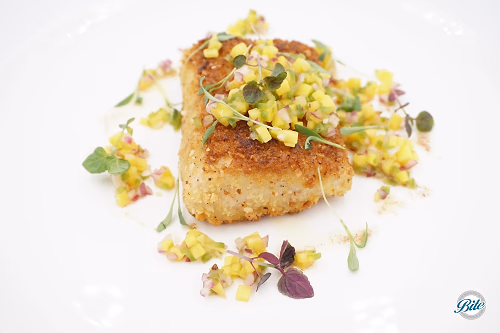 Mahi Mahi plated w/ mango salsa. View from top