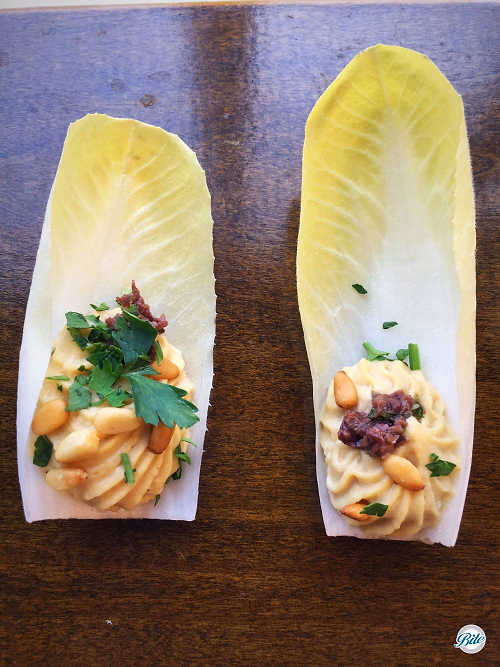 Belgian Endive Capape with Hummus and Pine Nuts
