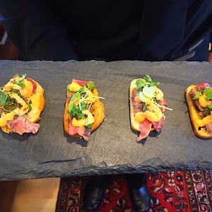 Grilled Flank Stank Crostini on Slate Tray
