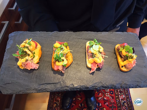 Grilled Flank Stank Crostini on Slate Tray