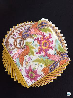 Floral Napkins Stacked on Black