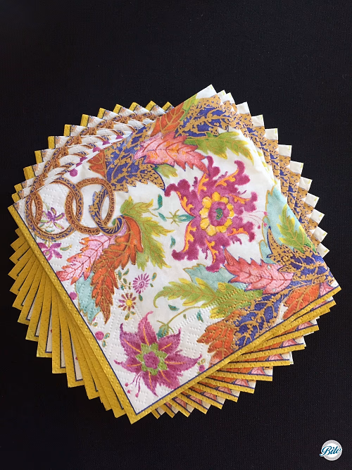 Floral Napkins Stacked on Black