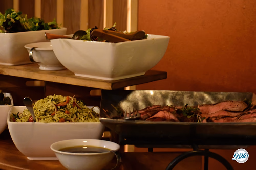 Orzo salad piled high on buffet