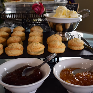Closeup of scones, clotted cream, and jam