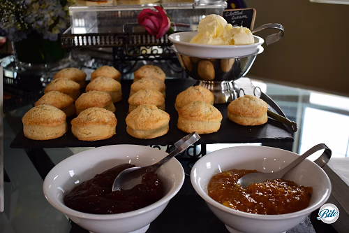 Closeup of scones, clotted cream, and jam