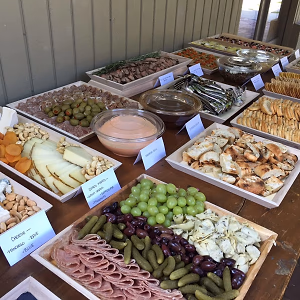 Buffet Table with Highlighted Hearty Platters on Wooden Trays