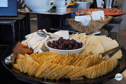 Three Cheese Assortment with preserves and olives