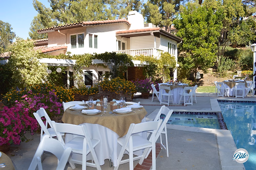 Tables Set Up In Backyard Around Pool