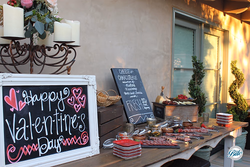 Cheese and Charcuterie Table Decorated with Chalkboard Signage