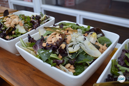 Spanish Harvest Salad in White Bowls on Wooden Display 
