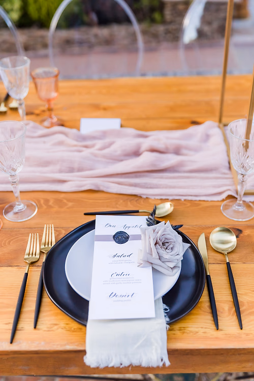 An elegant black, gold and pink tablescape