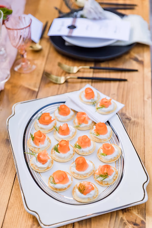 Homemade yeast-raised blini with smoked salmon, creme fraiche, caviar and dill