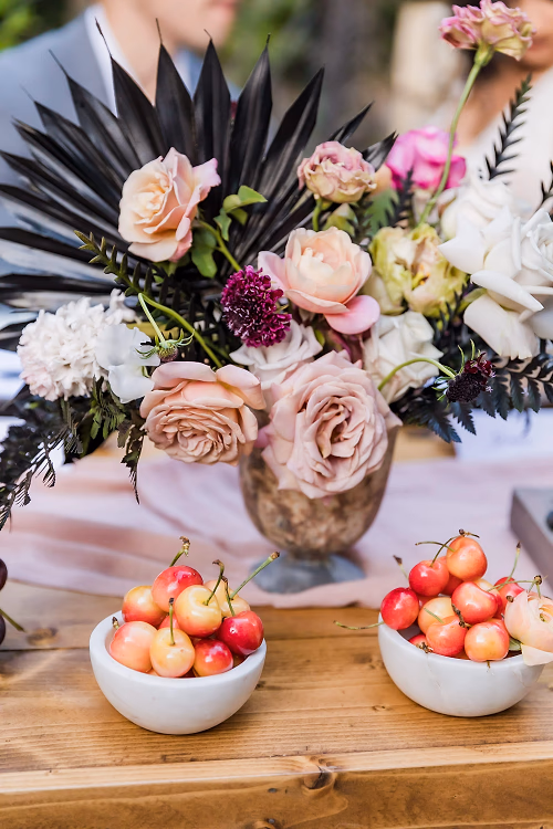 Seasonal pink, black and gold floral for an elegant Houdini Estate wedding with bing cherries