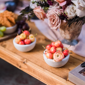 Elegant wedding tablescape with family-style cheese and charcuterie