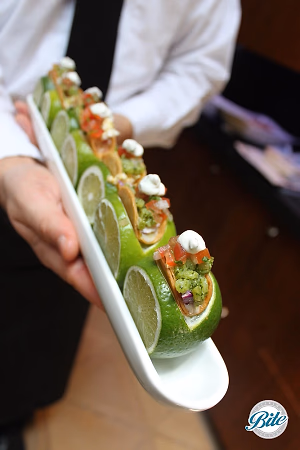 Mini tacos served on limes 