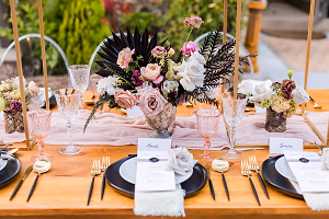 Elegant black, gold and blush tablesetting outdoors