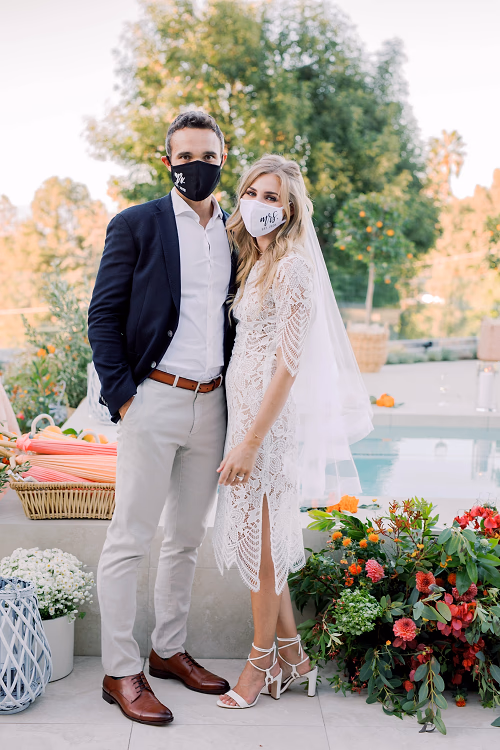 Bride and groom keeping things safe in masks