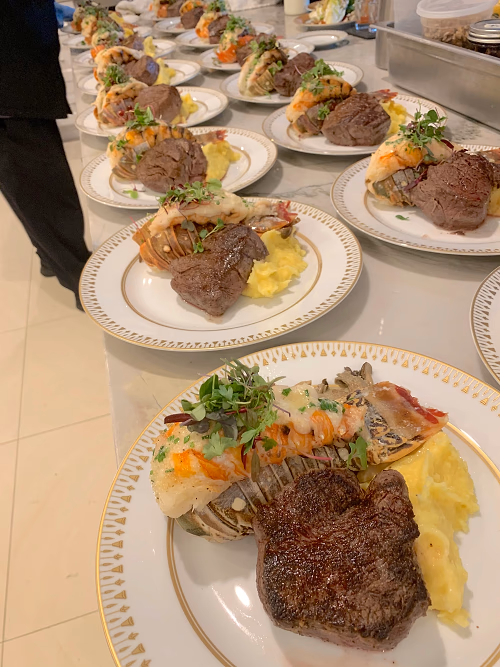 A luxurious steakhouse inspired menu to include sous vide filet mignon and butter-poached lobster tail