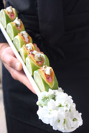 Mini fish taco served on fresh lime