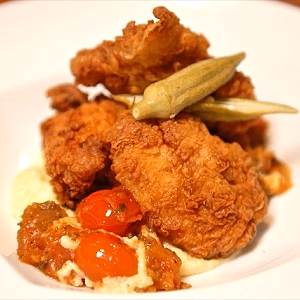 Tea-brined buttermilk fried chicken, smoked gouda grits, stewer tomatoes and okra