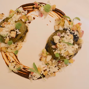 Tomatillo with corn relish and mole