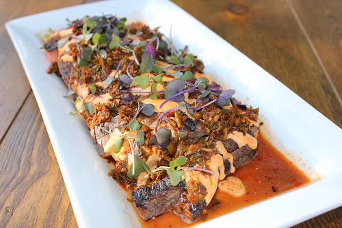 seared thinly-sliced cassis and red wine marinated flank steak with housemade chimichurri with sriracha aioli