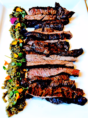 salt and pepper sliced seared skirt steak  with habanero chimichurri and micro cress