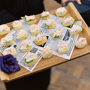 Mini lobster rolls passed on wood tray