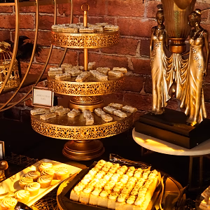 Lavish dessert display with mini pies, mini tarts, and dessert bars