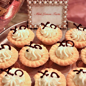 Mini lemon tarts decorated with valentines themed chocolate XO