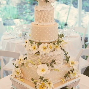 Elegant tiered wedding cake with sugar decor