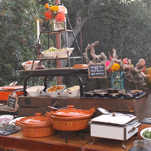 Elegant and thematic wedding dinner action station display 